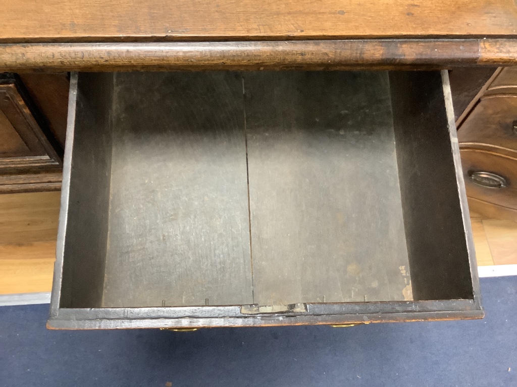 A small 18th century oak two drawer low dresser, width 124cm depth 56cm height 79cm